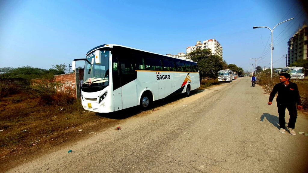 Image of a comfortable and spacious 50 seater bus for rent in Delhi, with air conditioning and ample space for luggage.