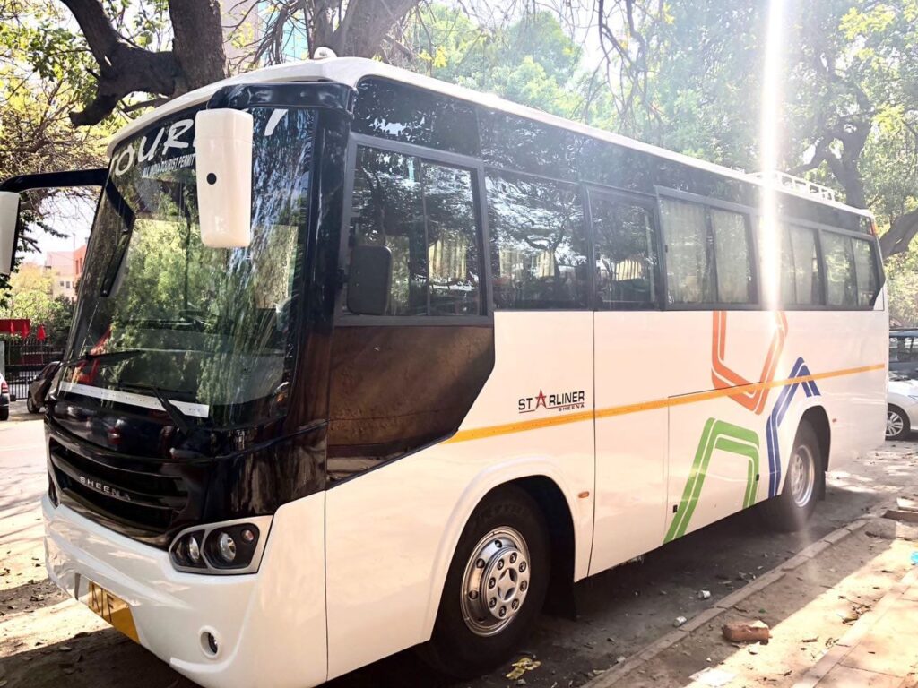 A comfortable 27-seater mini bus available for rent in Delhi